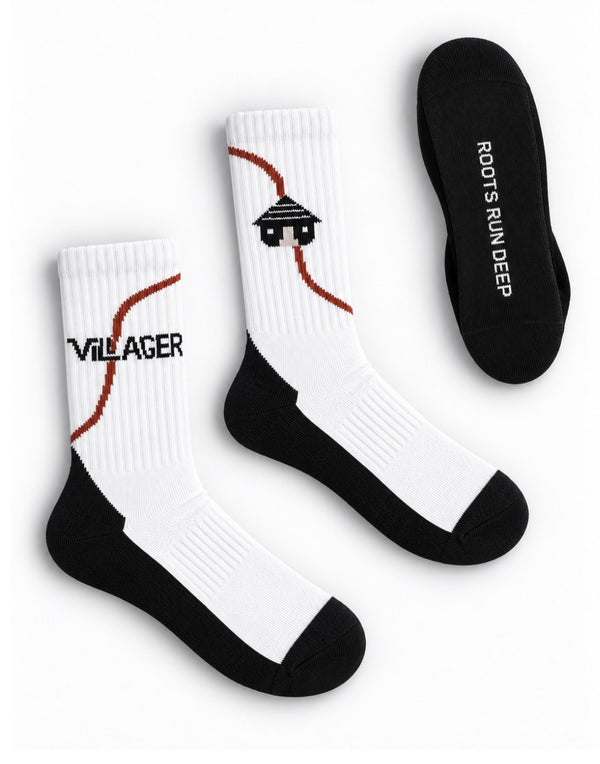 Villager RRD crew socks in white, with VILLAGER wordmark, hut logo and Roots Run Deep sole detail