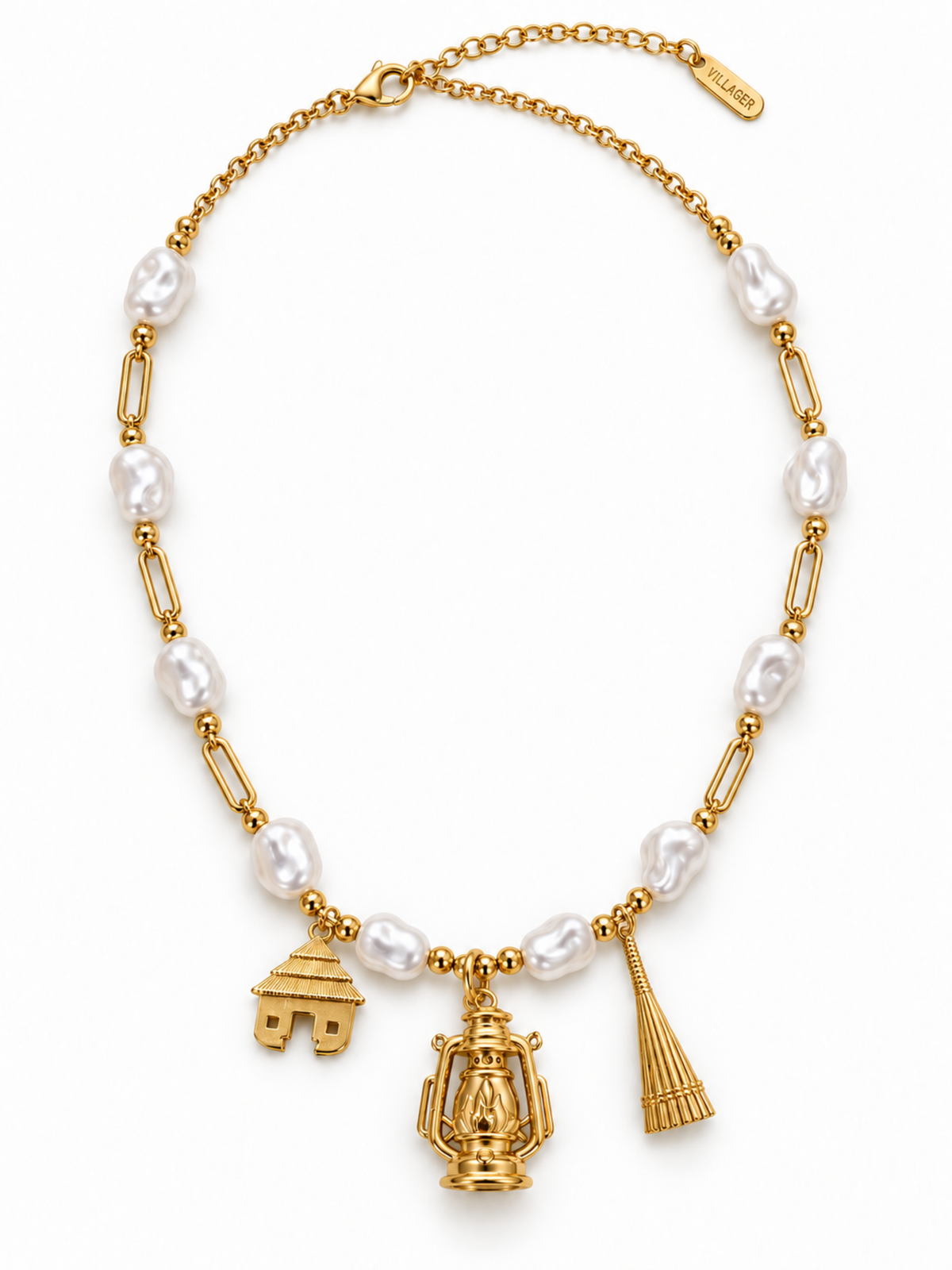 Villager Roots gold necklace with ten pearl-effect acrylic beads and hut, lantern and broom pendants, on a white background