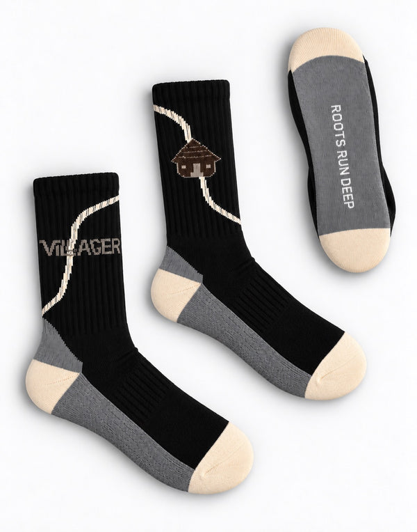 Villager RRD crew socks in black, with VILLAGER wordmark, hut logo and Roots Run Deep sole detail